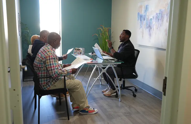 Trial Access Partner providing educational materials to patients